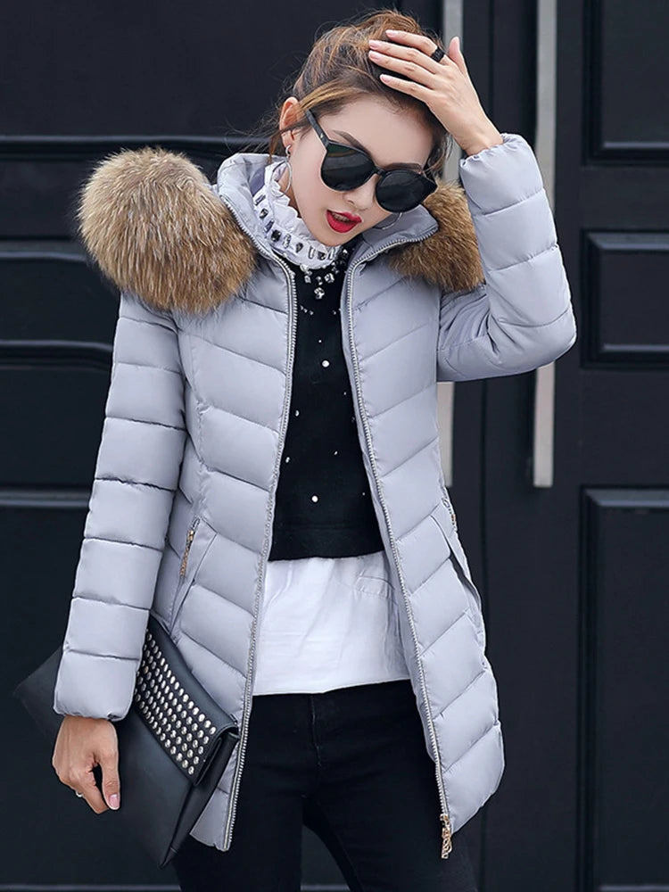 Cece | Long fur jacket with puffer details